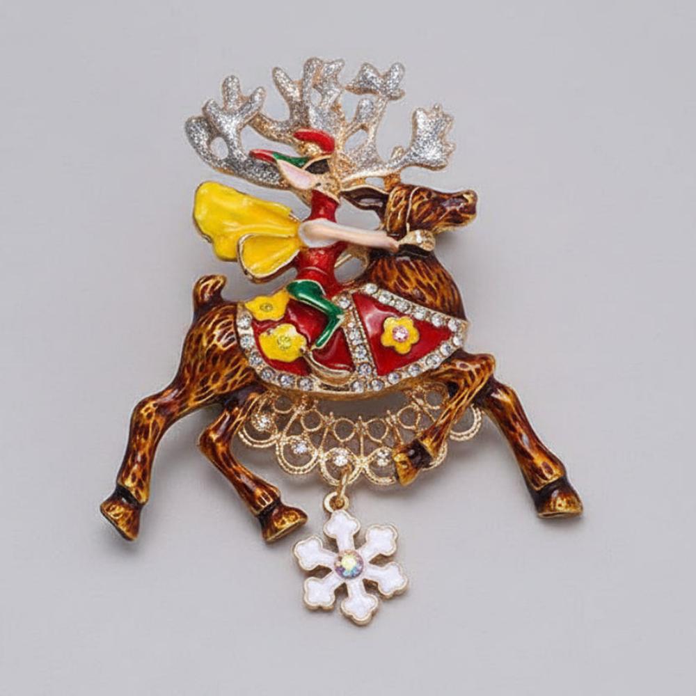 Christmas elf riding atop a beautifully detailed reindeer, with colorful hand fired enamel and pave' set crystal rhinestones on a light gray background
