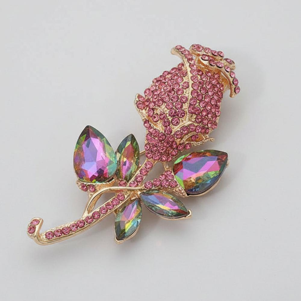 Pink vitrail glass tulip-shaped brooch on light gray background